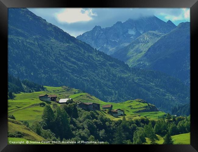Village nestled in the Swiss Alps. Framed Print by Joanne Court