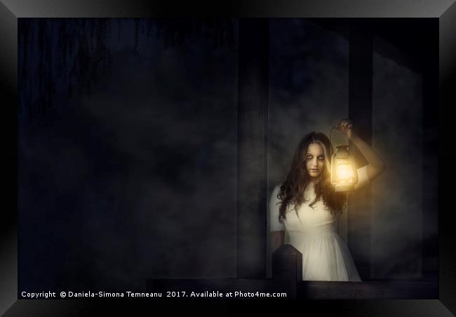 Scary woman with lantern in night scene Framed Print by Daniela Simona Temneanu