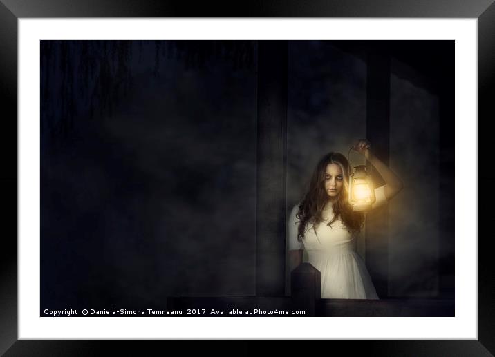 Scary woman with lantern in night scene Framed Mounted Print by Daniela Simona Temneanu