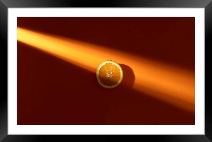 Orange slice in sunlight. Fresh slice of orange. Minimal image Framed Mounted Print by Daniela Simona Temneanu