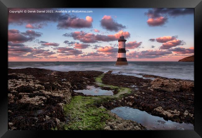 Dramatic Sunset Over Trwyn Du Lighthouse Framed Print by Derek Daniel