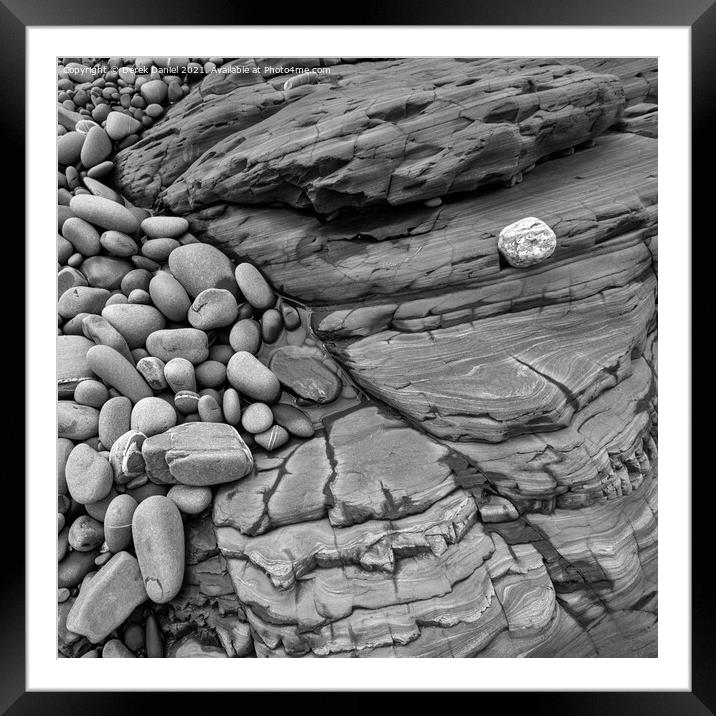 Rocks on the beach at Sandymouth (mono) Framed Mounted Print by Derek Daniel