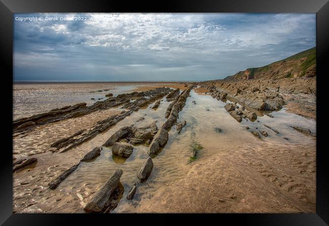 Rocks on Saunton Sands Framed Print by Derek Daniel