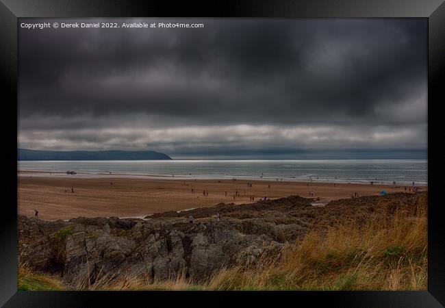 Dark Storm Clouds over Woolacombe  Framed Print by Derek Daniel