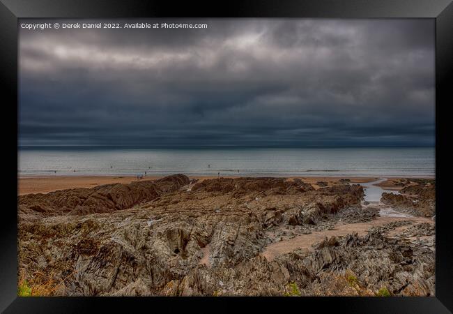 Dark Storm Clouds over Woolacombe  Framed Print by Derek Daniel