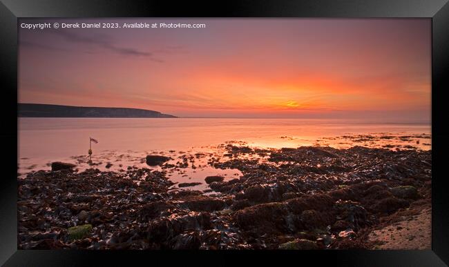 Sunrise at Swanage Framed Print by Derek Daniel