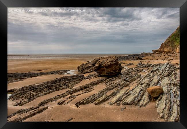 Rocks on Saunton Sands Framed Print by Derek Daniel