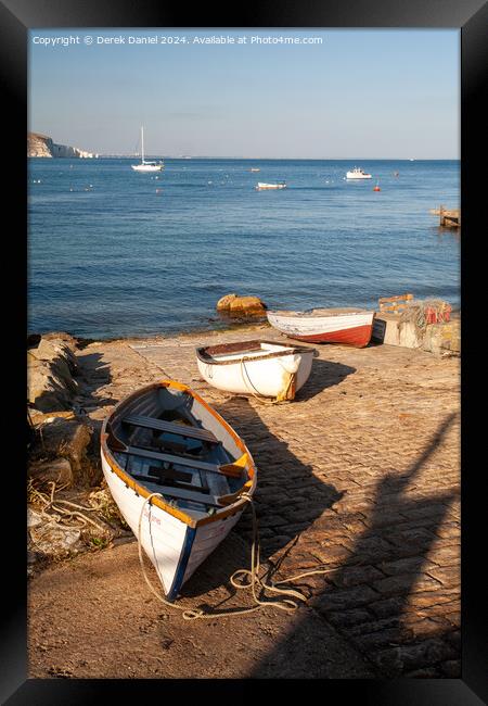 boats on the slipway at Swanage Framed Print by Derek Daniel