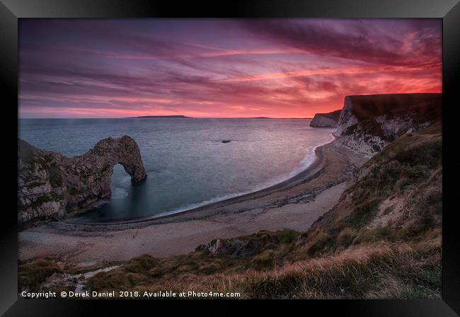 Fiery sunset over Durdle Door Framed Print by Derek Daniel