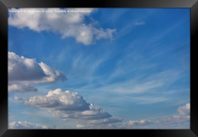 A blue sky background with a texture of white fluffy clouds Framed Print by Sergii Petruk