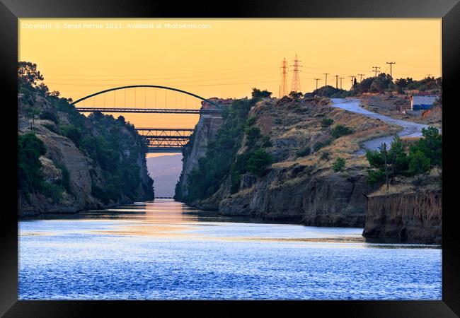 The Corinth Canal transport corridor between two seas in Greece in the early morning haze. Framed Print by Sergii Petruk