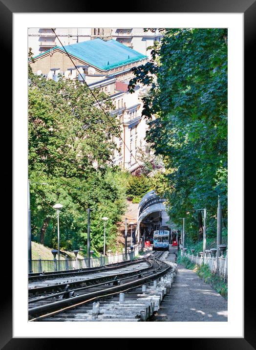 Funicular rail track, the car is filled with passengers at the lower station, surrounded by a summer green park. Framed Mounted Print by Sergii Petruk