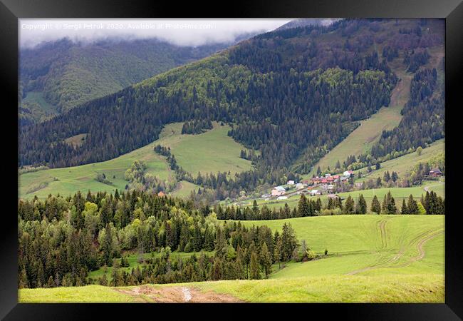 Carpathians. Mountain landscape. Village in the valley among coniferous forests Framed Print by Sergii Petruk