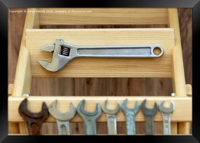 Old Construction tools on wooden slats close-up Framed Print by Sergii Petruk