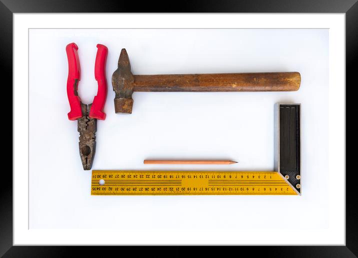 Hammer with wooden handle, pliers, square and pencil isolated on light background closeup Framed Mounted Print by Sergii Petruk