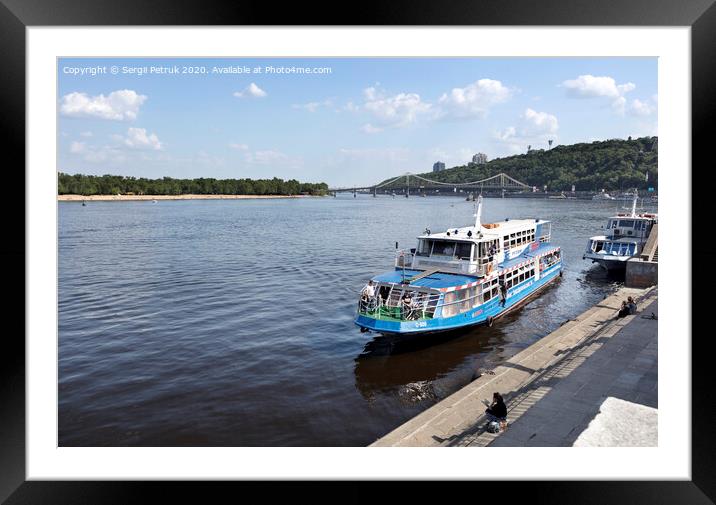 Pleasure boat moored at the city wharf of the Dnipro River Framed Mounted Print by Sergii Petruk
