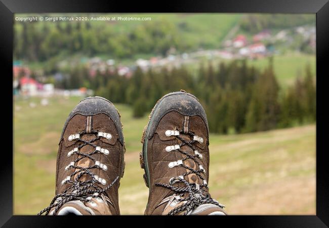 Mountain trekking boots close-up after a long journey through the mountains Framed Print by Sergii Petruk