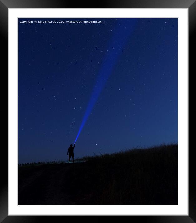 Silhouette of man on a background of stars..Man desires guess looking at the stars. Framed Mounted Print by Sergii Petruk