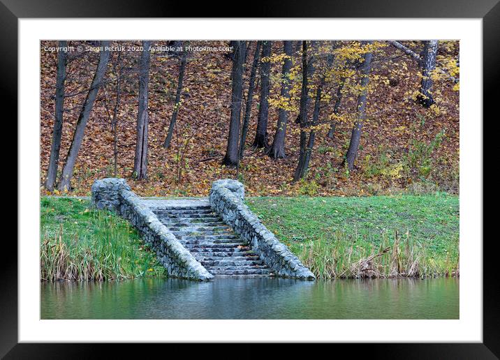 old steps of stone descent on the shore of a forest pond. Framed Mounted Print by Sergii Petruk
