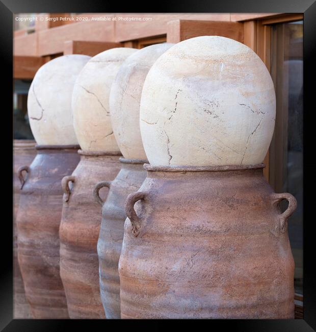 Large clay pots in a row for sale Framed Print by Sergii Petruk
