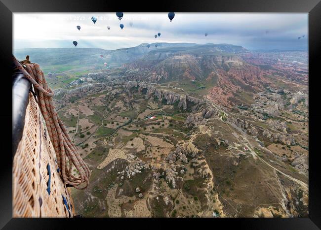A balloons is flying over the valley in Cappadocia Framed Print by Sergii Petruk