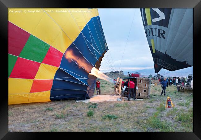 13.05.2018. Cappadocia, Goreme, Turkey. The process of inflating hot air balloons Framed Print by Sergii Petruk