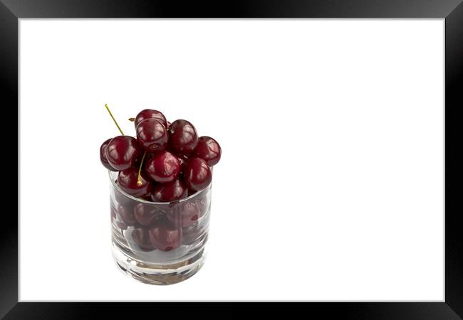 Red cherry in a transparent glass isolated on a white background Framed Print by Sergii Petruk