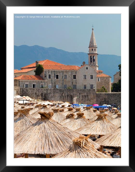 Thatched roofs of beach umbrellas in the bright sun Framed Mounted Print by Sergii Petruk