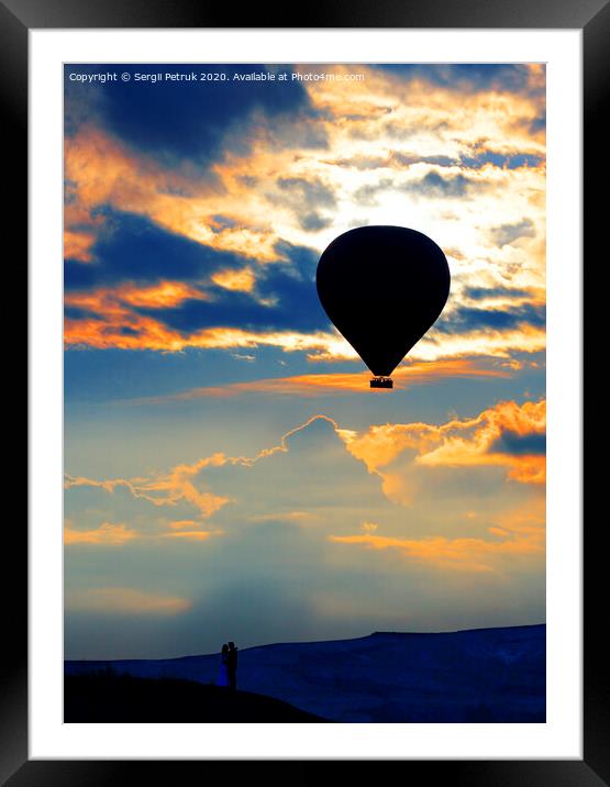 Silhouette of a loving couple and balloon against the morning sky with fiery red clouds Framed Mounted Print by Sergii Petruk