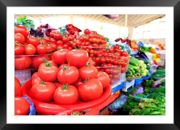 Tomatoes, cucumbers, spinach and other vegetables are sold on the market. Framed Mounted Print by Sergii Petruk