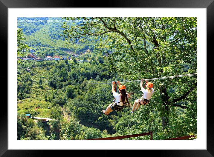 Tourists cross the long path through the mountain and forest across the river Tiara by cable car. Framed Mounted Print by Sergii Petruk