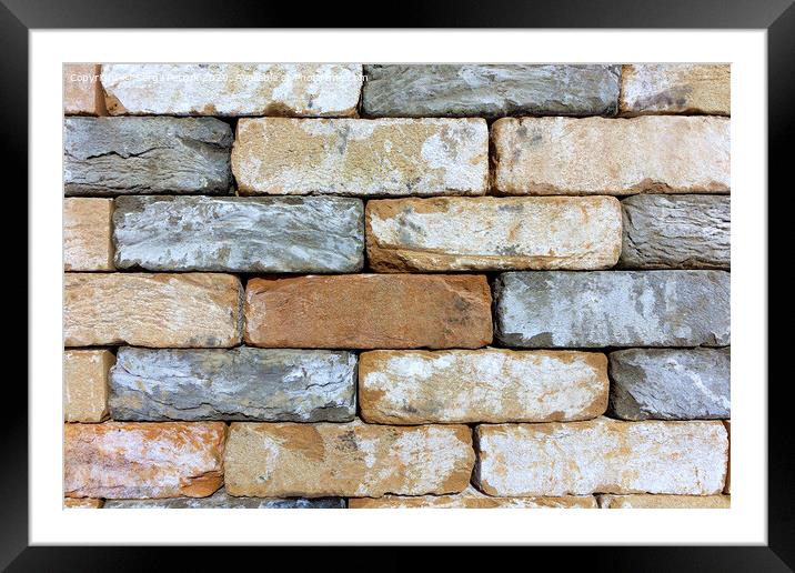 The texture of the stone wall of the old brick, building stone from sandstone. Framed Mounted Print by Sergii Petruk