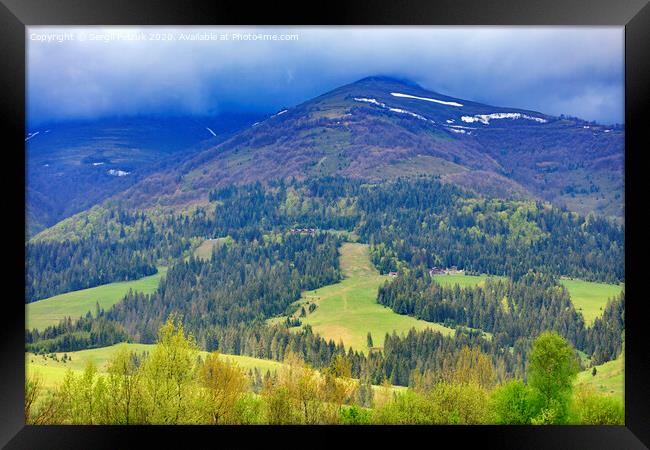 The landscape of the majestic mountain in the Carpathians along the slope of which the cable lift is laid. Framed Print by Sergii Petruk
