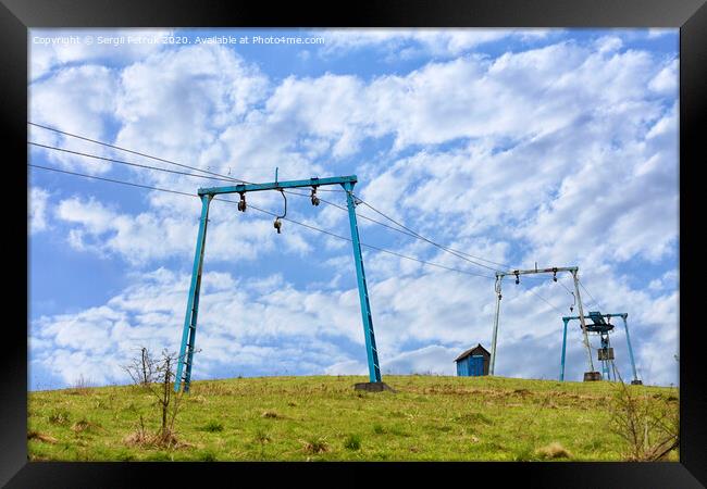 The framework of the mountain cable lift stand alone on the top of the mountain. Framed Print by Sergii Petruk
