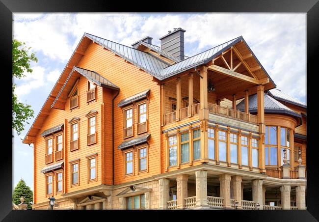 The facade of a beautiful wooden house in three floors. Framed Print by Sergii Petruk