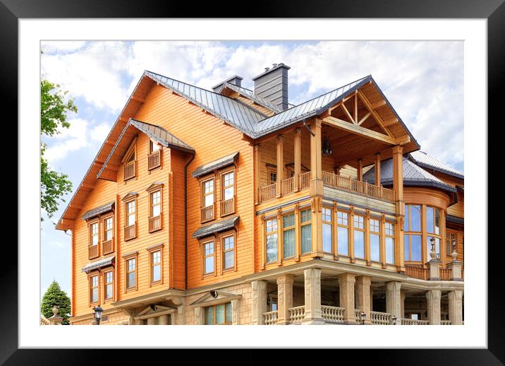 The facade of a beautiful wooden house in three floors. Framed Mounted Print by Sergii Petruk