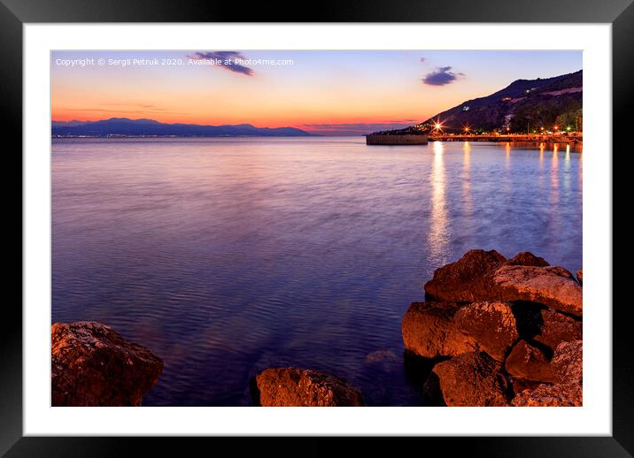 Beautiful, bright sunset on the Corinthian bay at night Loutraki, Greece. Framed Mounted Print by Sergii Petruk