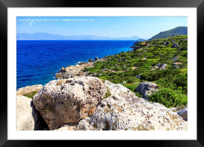The coastline of the Ionian Sea is dotted with large stone boulders. Framed Mounted Print by Sergii Petruk