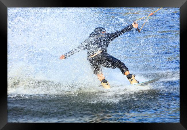 Wakeboarder rushing through the water at high speed Framed Print by Sergii Petruk