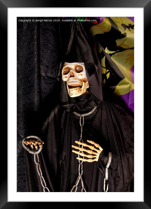 Halloween, death doll in a black hoodie with metal chains and shackles on his hands. Framed Mounted Print by Sergii Petruk
