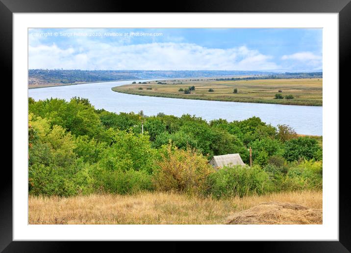 View of the roof of a rural house and the Southern Bug River from a hill. Framed Mounted Print by Sergii Petruk