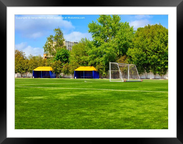 Green lawn of a soccer field with gates and tents for teams players. Framed Mounted Print by Sergii Petruk