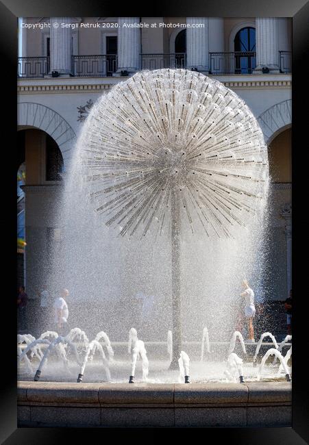 A beautiful city fountain in the shape of a huge dandelion refreshes passers-by against the background of the arched-column facade of the Kyiv City Conservatory. Framed Print by Sergii Petruk