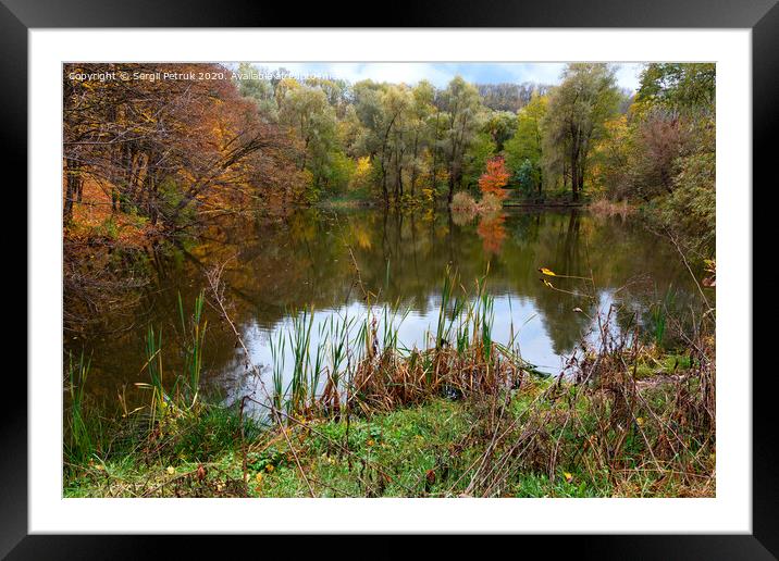 Landscape of autumn forest lake with blue sky reflection in water. Framed Mounted Print by Sergii Petruk