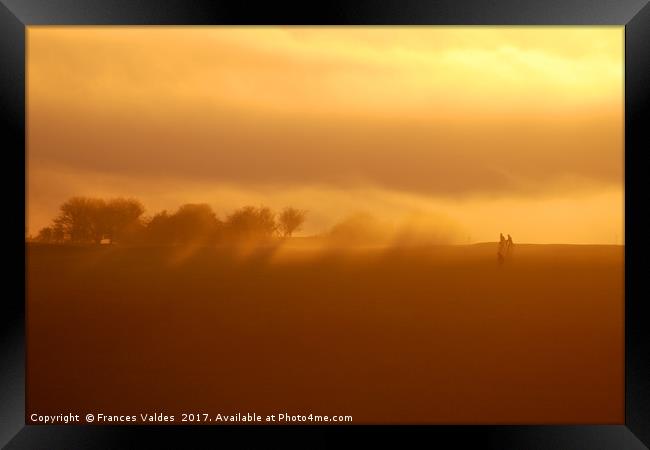 Trees and golfers silhouetted in fog at sunset Framed Print by Frances Valdes