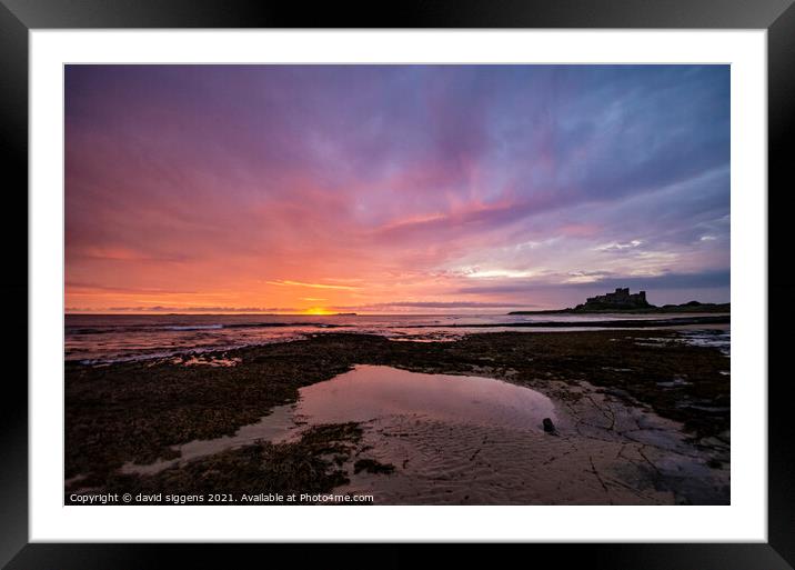 Bamburgh castle sunrise northumberland Framed Mounted Print by david siggens