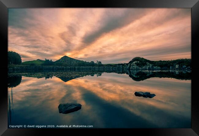 Cawfields Quarry rising sun fire Framed Print by david siggens