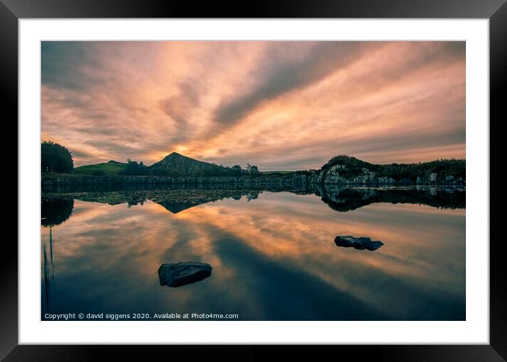 Cawfields Quarry rising sun fire Framed Mounted Print by david siggens