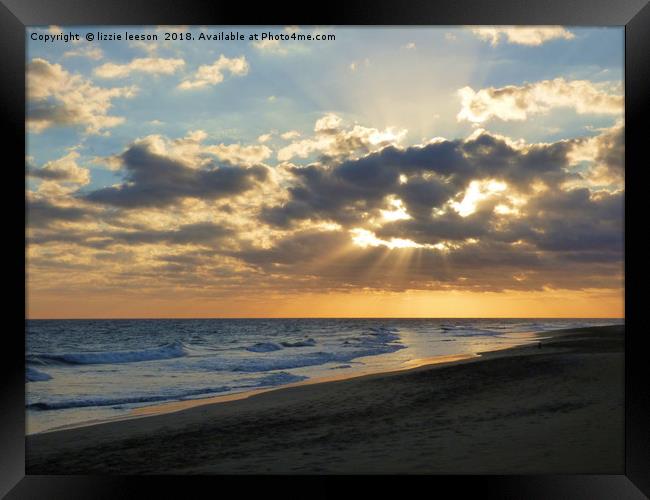 Glowing sunburst sunset  Framed Print by lizzie leeson