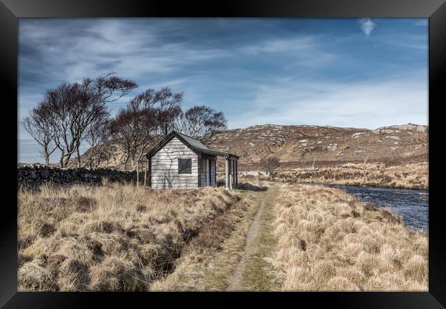 Cabin by the river Framed Print by Peter Scott